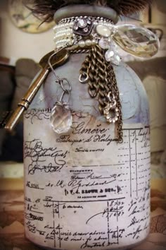 a bottle filled with lots of keys and chains