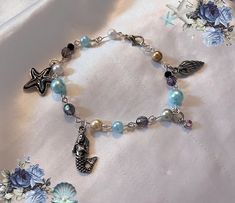 A beautiful coquette sirencore mermaid bracelet, very unique and pretty.  ️️️ Mermaid Bracelet Aesthetic, Mermaidcore Bracelet, Mermaid Beads Bracelet, Ocean-inspired Mermaid Shape Sterling Silver Jewelry, Sea Siren, Mermaid Bracelet, Bead Charm Bracelet, Deep Sea, Charm Jewelry