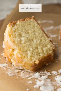 a piece of coconut cake sitting on top of a brown paper bag