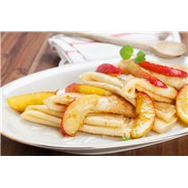 a white plate topped with french fries and fruit