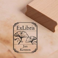 a wooden stamp with the words ex libris on it