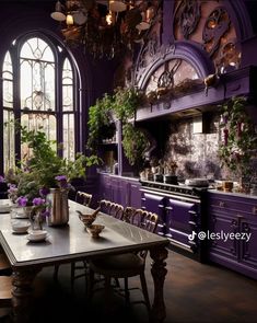 a dining room with purple walls and wooden table surrounded by potted plants in front of an arched window