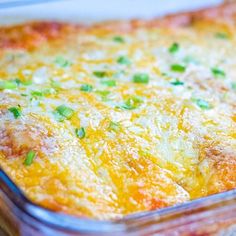 a casserole dish with cheese and green onions