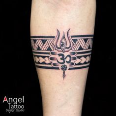 a black and white tattoo design on the leg