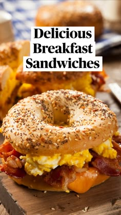 a bagel sandwich with bacon and eggs on it