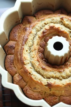 a bundt cake in a pan on a cooling rack