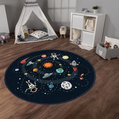 a child's room with a rug that has space and stars on it, including the planets