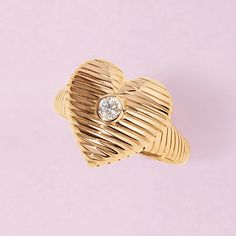 Carrying your heart on your fingers, literally. The solid gold textured heart ring is equally dreamy and bold. The diamond in the middle is the cherry on top of the piece, it adds that special glow. 14k solid gold Average diamond weight is 0.13cts Heart dimensions: 15 x 16mm Diamond Heart Jewelry, Strange Jewelry, Hotline Bling, Heart Rings, Luv Aj, Bold Rings, Geometric Diamond, St Valentin, Cherry On Top