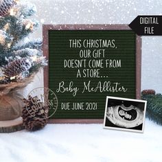 a christmas card with an image of a baby's boot and pine cones