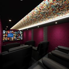 the interior of a home theater with purple walls