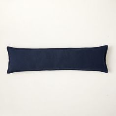 a blue pillow on a white background