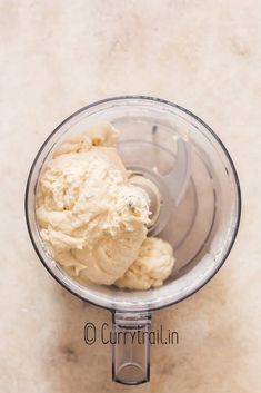 a blender filled with ice cream on top of a counter