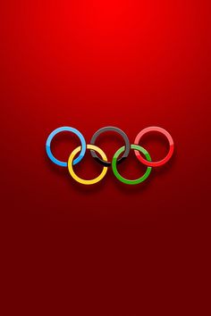 the olympic rings are displayed on a red background