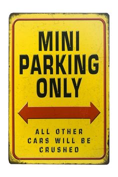 a yellow and black sign that says mini parking only all other cars will be crushed