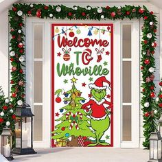 the grinch welcome door cover is decorated with christmas garlands and holiday decorations, along with lanterns