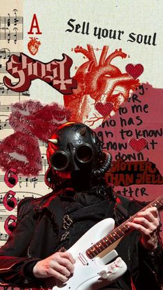 a man wearing a gas mask and holding an electric guitar in front of music sheets