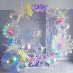 balloon decorations and balloons are arranged in the shape of stars, flowers, and other things