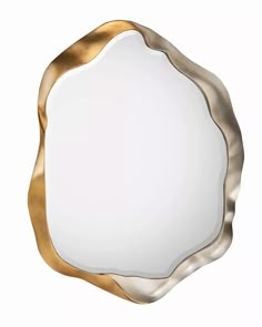 a white plate with gold trim and a round mirror in the middle, on a white background