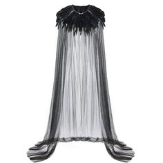 a black and white dress with feathers on it