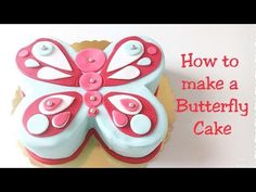 a cupcake decorated like a butterfly on top of a cake plate with the words how to make a butterfly cake