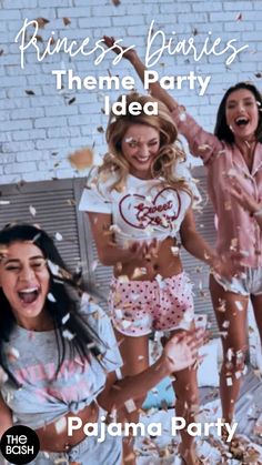 three girls in pajamas are throwing confetti on the floor and one girl is laughing