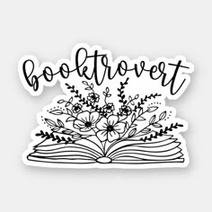 an open book with flowers and leaves on it that says boaftrovert