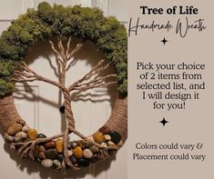 a wreath made out of branches and rocks with the words tree of life on it