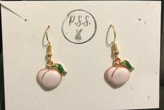 This is an adorable pair of bubbly white peach earrings! Cute Spring Earrings With Ear Wire, Orange Earrings For Spring Gift, Spring Gift Orange Earrings, Cute Orange Jewelry For Party, Cute Orange Party Jewelry, Cute Nickel-free Orange Jewelry, Peach Dangle Earrings For Party, Cute Orange Dangle Jewelry, Cute Rose Gold Jewelry With Matching Earrings