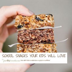 someone holding up some kind of granola bars with the words school snacks your kids will love