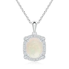 The exquisite design of this 18k white gold vintage style pendant reflects old world elegance. Exuding an eye-catching play of color, the oval opal looks stunning amid the dazzling diamond halo. The bezel-set accents and fine beading details elevate the beauty of this pendant. Old World Elegance, Opal Pendants, Diamond Halo, Exquisite Design, Halo Diamond, Bezel Setting