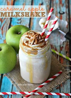 caramel apple milkshake in a mason jar with two apples