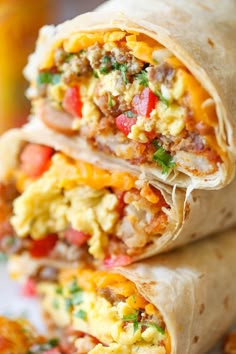 two burritos are stacked on top of each other