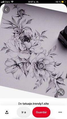 an image of flowers drawn on a sheet of paper with marker and pen next to it