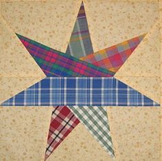 a quilted star with plaid fabric on it