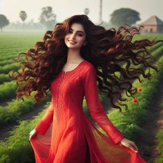 a woman with long hair in a red dress is walking through a green farm field