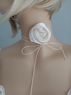 Romantic Royal Ivory Satin Rose Flower, Chain Necklace Adjustable Bowknot Rope, Choker Jewelry Accessories Rose Flower Choker Necklace, Rose Necklace, Flower Necklace,  Adjustable Handmade Necklace, Handmade Floral Choker Add a touch of vintage romance to your wedding day with this elegant choker. The rosette necklace will be the perfect accessory for you. You may use it in your hair, on your wrist, waist and as a choker.  It doesn't have a clasp so it's freely adjustable to your neck size. You can tie it comfortably for you.  The cord is adjustable for a comfortable fit around the neck, providing a perfect fit for any size. This necklace 2.5" Ivory satin flower with a long adjustable bow knot cord.  Materials: Satin fabric, cord Style: Boho Size: 2.5" Length of the cord: 60", adjustable. Rosette Necklace, Floral Choker, Rose Choker, Elegant Choker, Flower Choker Necklace, Flower Chain, Wrap Necklace, Choker Jewelry, Flower Choker