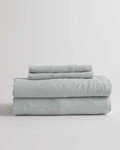 three linen sheets stacked on top of each other