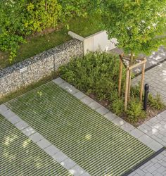 an aerial view of a park with benches and trees