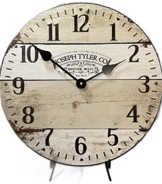 a clock with the words joseph tyer co on it's face and hands