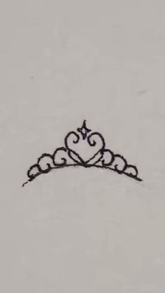 a black and white drawing of a tiara