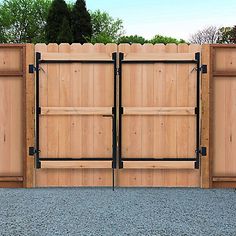 two wooden gates with black hardware on each side and one closed in the other direction