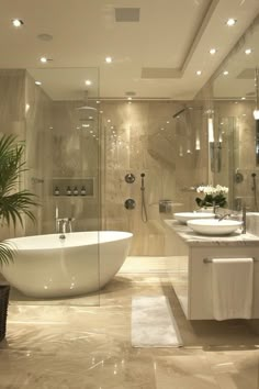 a large bathroom with two sinks and a bathtub in the middle of the room