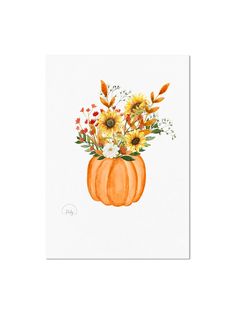 an orange pumpkin with flowers in it