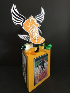 Party centerpiece with a running theme Running Themed Party Decorations, Cross Country Centerpieces, Xc Banquet Centerpieces, Track And Field Centerpiece Ideas, Xc Banquet Ideas, Track Centerpiece Ideas, Track Themed Graduation Party, Track Graduation Party Ideas, Cross Country Centerpiece Ideas