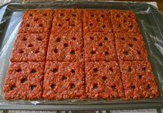 some kind of food that is sitting on a sheet of tin foil and ready to be baked