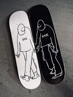 two skateboards that have been drawn on to the side of each other, one with a man and woman holding hands