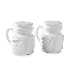 two white mason jars sitting next to each other