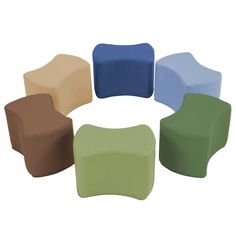 several different colored chairs arranged in a circle