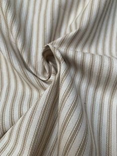 a close up view of a white and brown striped fabric