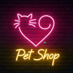 a neon sign that says pet shop with a cat's head in the shape of a heart